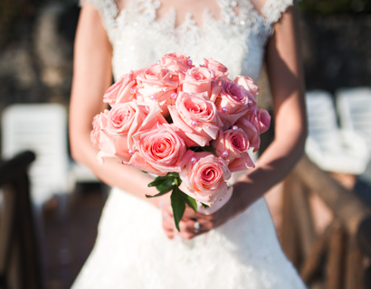 Bride with lovely wedding florist bouquet on her big day